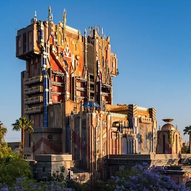 Excited group of friends holding theme park tickets and phones