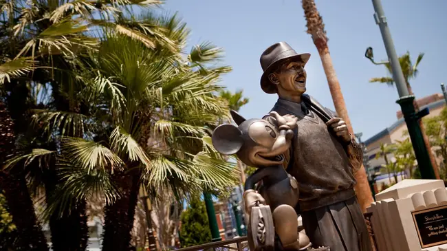 Tourists looking at park map on their mobile devices outdoors