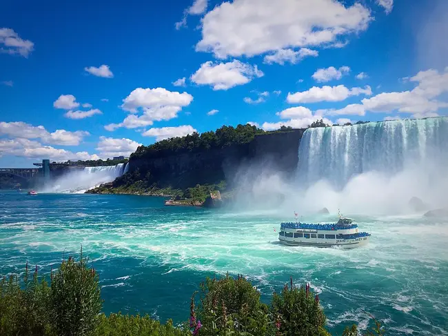 Outdoor observation deck at Journey Behind the Falls showing the massive waterfall cascade