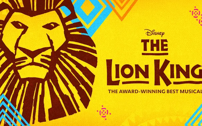 The vibrant night view of the Minskoff Theatre marquee