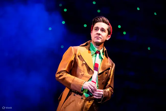 Wicked fans taking photos at the green Oz-themed photo zone