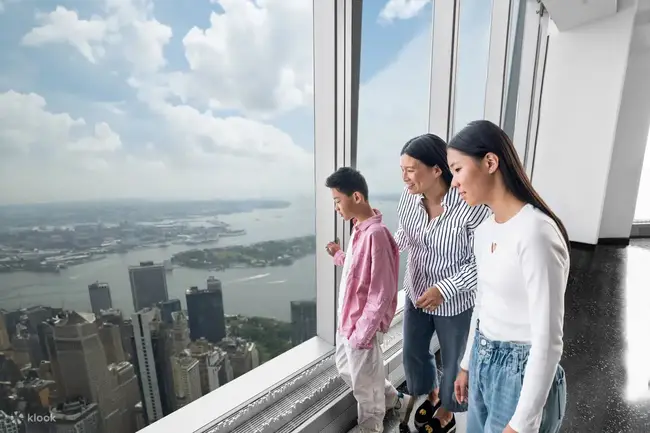 Happy couple enjoying the night view at One World Observatory